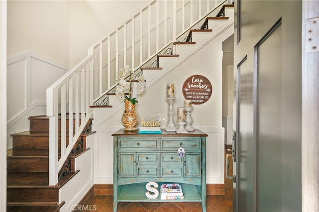 806 N Irena Ave Unit A, Redondo Beach, CA 90277 - stairs featuring a decorative wall, a wainscoted wall, and tile patterned floors