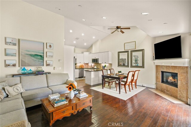 806 N Irena Ave Unit A, Redondo Beach, CA 90277 - living room with ceiling fan, hardwood / wood-style flooring, a tiled fireplace, high vaulted ceiling, and recessed lighting