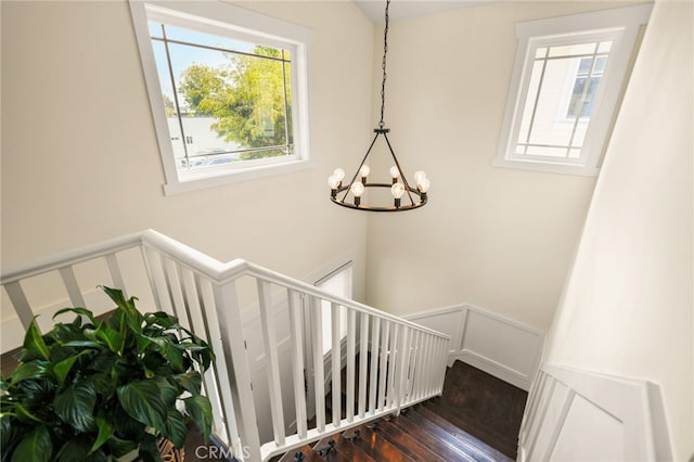 806 N Irena Ave Unit A, Redondo Beach, CA 90277 - stairway featuring healthy amount of natural light, a chandelier, hardwood / wood-style flooring, a decorative wall, and wainscoting