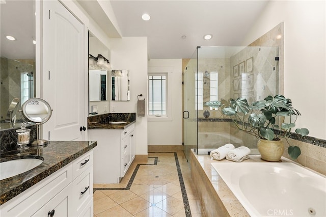 806 N Irena Ave Unit A, Redondo Beach, CA 90277 - bathroom featuring a shower stall, two vanities, a jetted tub, plenty of natural light, and recessed lighting