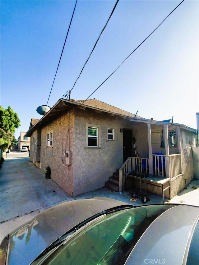 211 W 52nd St, Los Angeles, CA 90037 - rear view of property with stucco siding