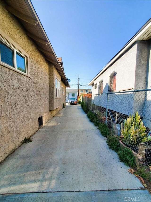 211 W 52nd St, Los Angeles, CA 90037 - view of home's exterior with stucco siding