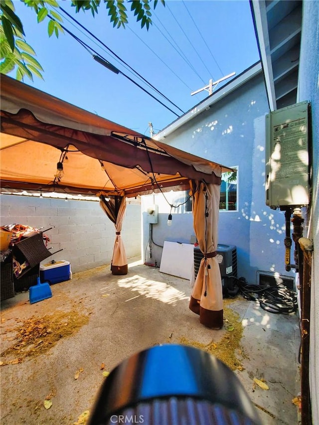 211 W 52nd St, Los Angeles, CA 90037 - fenced backyard with a gazebo and a patio