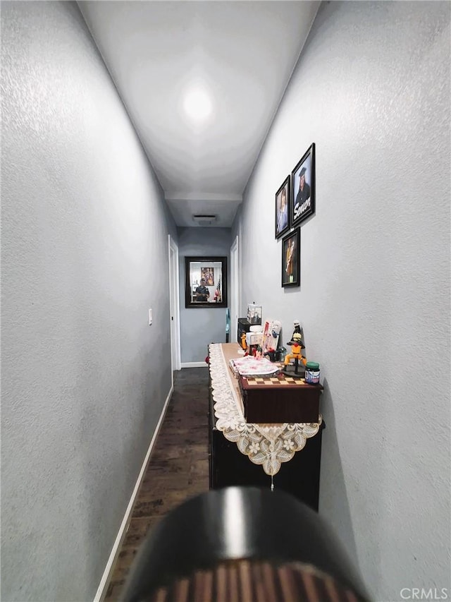 211 W 52nd St, Los Angeles, CA 90037 - hallway featuring dark wood-style floors and baseboards