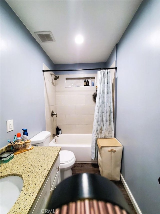 211 W 52nd St, Los Angeles, CA 90037 - bathroom with vanity, shower / tub combo, and wood finished floors
