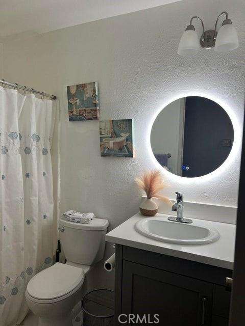 44603 13th St E, Lancaster, CA 93535 - bathroom featuring vanity and a shower with shower curtain
