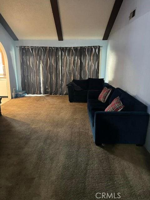 44603 13th St E, Lancaster, CA 93535 - carpeted living area with beamed ceiling and arched walkways