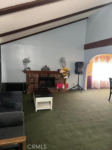 44603 13th St E, Lancaster, CA 93535 - living room featuring a fireplace, carpet, and a textured ceiling