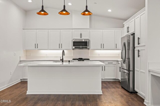 307 N F St Unit 201, Oxnard, CA 93030 - kitchen featuring appliances with stainless steel finishes, light countertops, lofted ceiling, white cabinetry, and recessed lighting