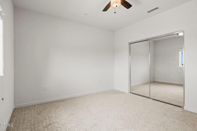 307 N F St Unit 201, Oxnard, CA 93030 - unfurnished bedroom featuring carpet, a closet, and a ceiling fan