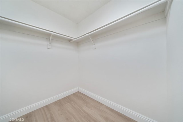 23760 Timber Bluff Ct, Moreno Valley, CA 92557 - spacious closet with light wood-type flooring
