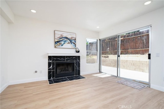 23760 Timber Bluff Ct, Moreno Valley, CA 92557 - unfurnished living room featuring wood finished floors, a fireplace, and recessed lighting