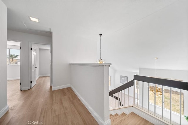 23760 Timber Bluff Ct, Moreno Valley, CA 92557 - corridor featuring wood finished floors and an upstairs landing