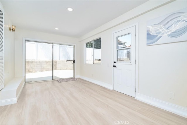 23760 Timber Bluff Ct, Moreno Valley, CA 92557 - empty room with healthy amount of natural light, light wood-style flooring, and recessed lighting