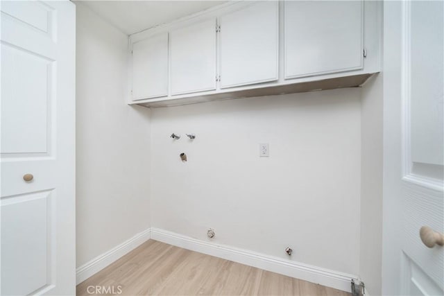 23760 Timber Bluff Ct, Moreno Valley, CA 92557 - washroom featuring cabinet space, light wood-style floors, washer hookup, and hookup for a gas dryer