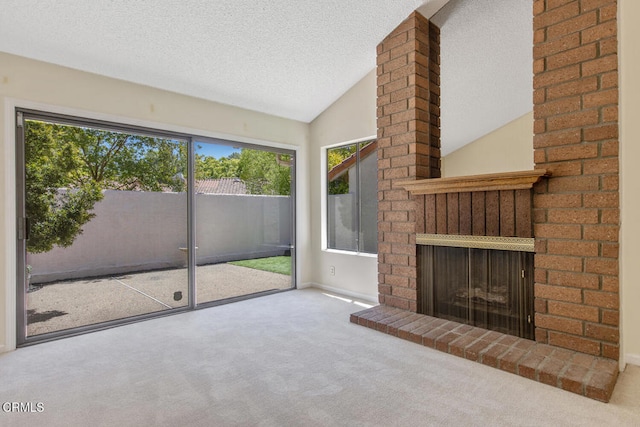4062 Bridgewood Ln, Thousand Oaks, CA 91362 - unfurnished living room with carpet, a textured ceiling, vaulted ceiling, and a fireplace