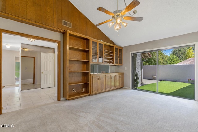 4062 Bridgewood Ln, Thousand Oaks, CA 91362 - unfurnished living room with light carpet, a ceiling fan, light tile patterned floors, and high vaulted ceiling
