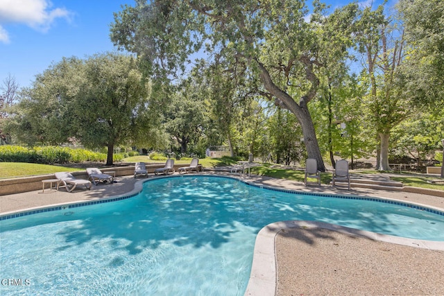 4062 Bridgewood Ln, Thousand Oaks, CA 91362 - swimming pool with view of scattered trees and a patio area