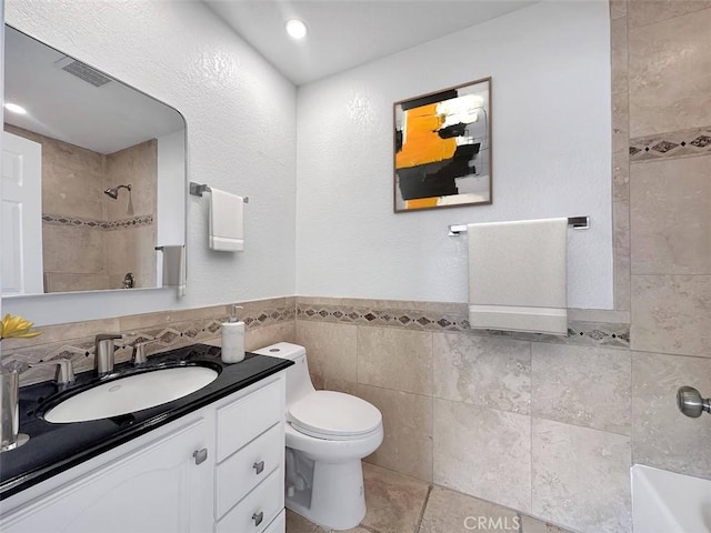 17333 Brookhurst St Unit D6, Fountain Valley, CA 92708 - bathroom with tile walls, vanity, wainscoting, and recessed lighting