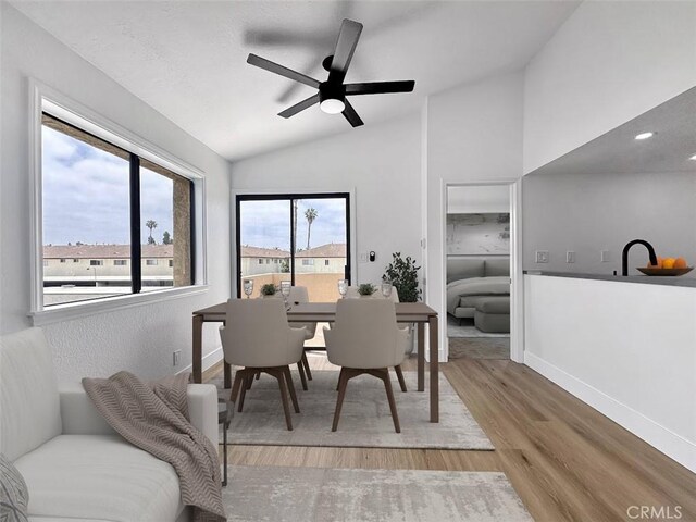 17333 Brookhurst St Unit D6, Fountain Valley, CA 92708 - dining area with lofted ceiling, wood finished floors, and a ceiling fan