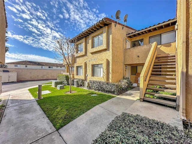 17333 Brookhurst St Unit D6, Fountain Valley, CA 92708 - view of front of home featuring stairs and stucco siding