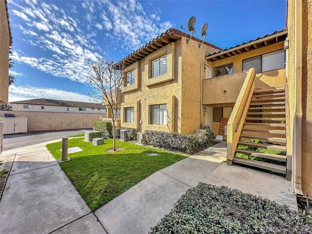 17333 Brookhurst St Unit D6, Fountain Valley, CA 92708 - view of front of home featuring stairs and stucco siding