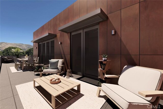 581 Higuera St Unit 306, San Luis Obispo, CA 93401 - view of patio with outdoor dining area, a mountain view, and an outdoor hangout area