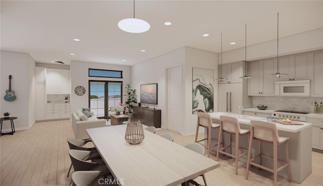 581 Higuera St Unit 306, San Luis Obispo, CA 93401 - dining room with light wood-style floors and recessed lighting