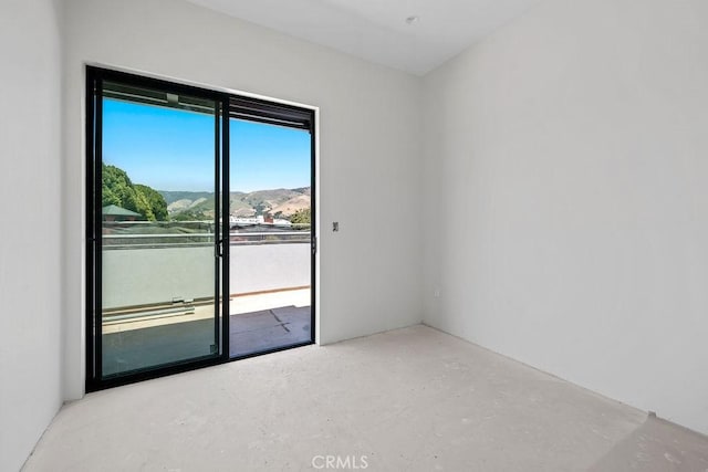 581 Higuera St Unit 306, San Luis Obispo, CA 93401 - empty room with concrete floors and a mountain view