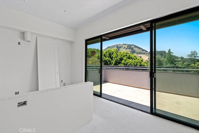 581 Higuera St Unit 306, San Luis Obispo, CA 93401 - unfurnished room featuring a mountain view and concrete flooring