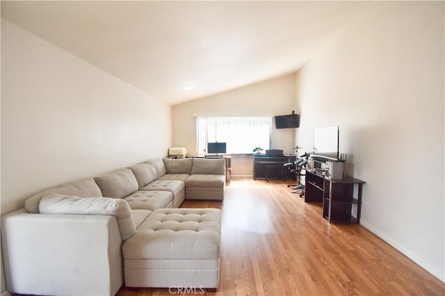22692 Abington Pl, Moreno Valley, CA 92553 - living room with vaulted ceiling and light wood-style flooring
