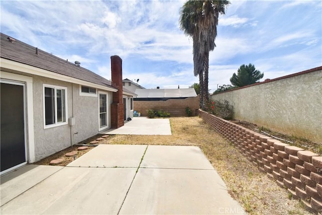 22692 Abington Pl, Moreno Valley, CA 92553 - fenced backyard featuring a patio area