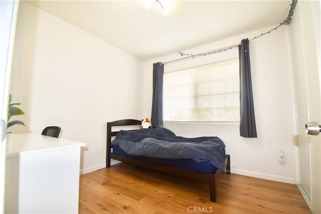 22692 Abington Pl, Moreno Valley, CA 92553 - bedroom featuring baseboards and light wood-style flooring