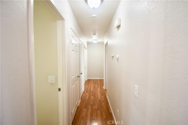22692 Abington Pl, Moreno Valley, CA 92553 - hall with wood finished floors and baseboards