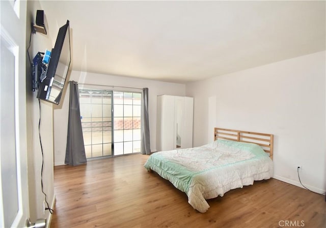 22692 Abington Pl, Moreno Valley, CA 92553 - bedroom with wood finished floors and baseboards