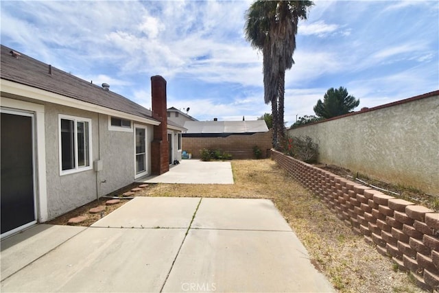 22692 Abington Pl, Moreno Valley, CA 92553 - fenced backyard featuring a patio