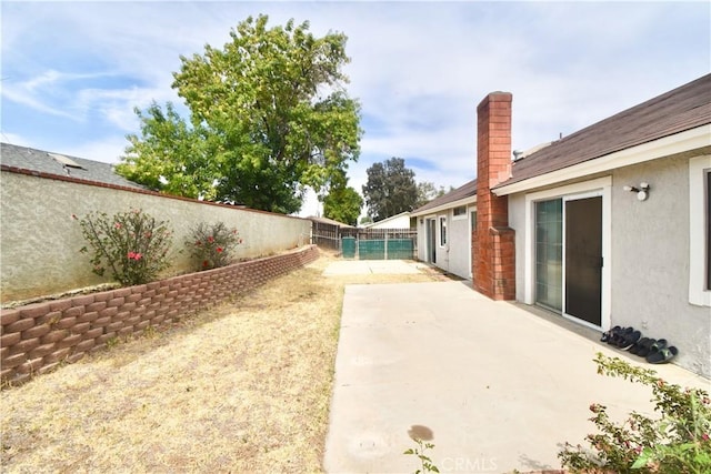 22692 Abington Pl, Moreno Valley, CA 92553 - fenced backyard with a patio area
