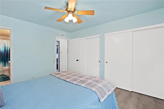 23011 Aspan St, Lake Forest, CA 92630 - bedroom with multiple closets, wood finished floors, ensuite bathroom, and a ceiling fan