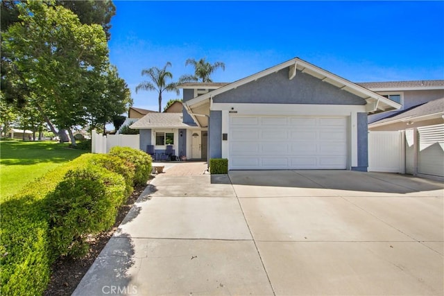 23011 Aspan St, Lake Forest, CA 92630 - ranch-style home featuring concrete driveway, a garage, and stucco siding
