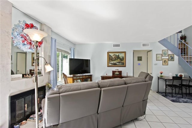 23011 Aspan St, Lake Forest, CA 92630 - living room featuring light tile patterned floors, a premium fireplace, and stairway