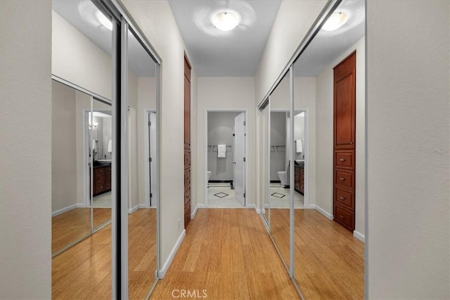 14844 Dickens St Unit 208, Sherman Oaks, CA 91403 - hallway featuring light wood-style flooring