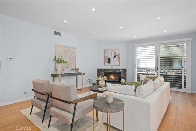 14844 Dickens St Unit 208, Sherman Oaks, CA 91403 - living room featuring light wood-style flooring, recessed lighting, and a high end fireplace
