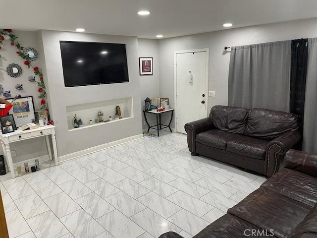 38950 164th St E, Palmdale, CA 93591 - living room with recessed lighting and marble look tile flooring