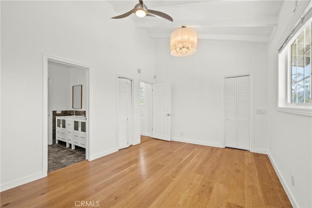 4919 Dunsmore Ave, La Crescenta, CA 91214 - unfurnished room featuring ceiling fan, beam ceiling, healthy amount of natural light, light wood-style flooring, and a chandelier