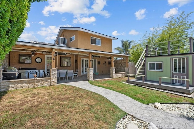 4919 Dunsmore Ave, La Crescenta, CA 91214 - back of house featuring a lawn, ceiling fan, stairway, area for grilling, and a patio area