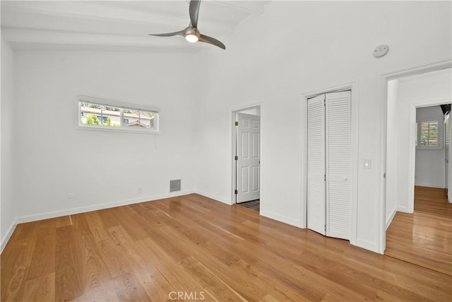 4919 Dunsmore Ave, La Crescenta, CA 91214 - unfurnished bedroom with light wood-style floors, a closet, ceiling fan, and vaulted ceiling