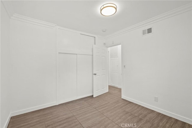 4919 Dunsmore Ave, La Crescenta, CA 91214 - unfurnished bedroom featuring a closet and crown molding