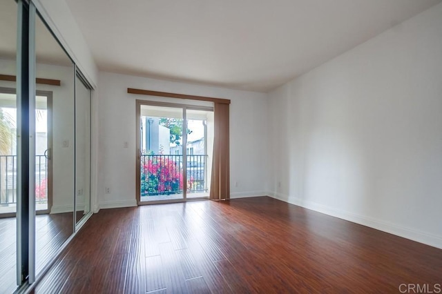 1045 Peach Ave Unit 12, El Cajon, CA 92021 - empty room with dark wood finished floors and baseboards
