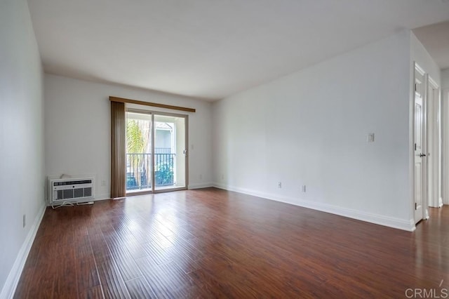 1045 Peach Ave Unit 12, El Cajon, CA 92021 - empty room with dark wood finished floors and an AC wall unit