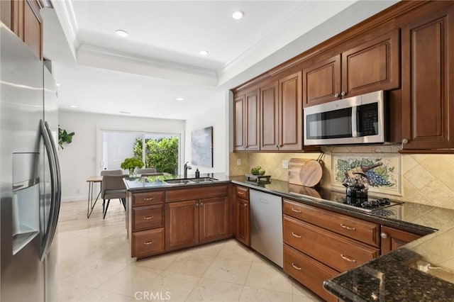 403 Vista Parada, Newport Beach, CA 92660 - kitchen with appliances with stainless steel finishes, a peninsula, decorative backsplash, ornamental molding, and recessed lighting